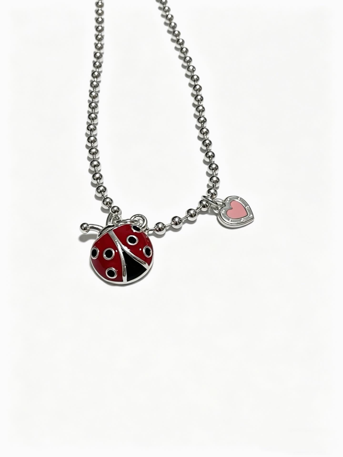 Tiffany & Co. Silver Beaded Necklace with Ladybug and Heart Charms